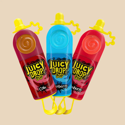Image de Juicy Drop Pop en trois saveurs : cola, framboise bleue, et fraise.
